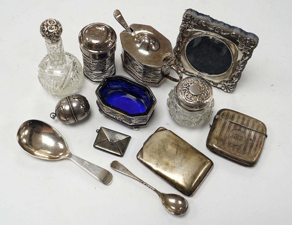 Sundry small silver etc., including condiments, toilet jars, vesta case, sterling envelope stamp case, plated match sleeve and silver caddy spoon. Condition - poor to fair